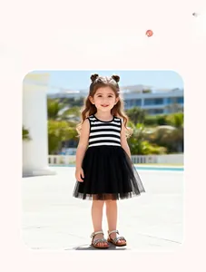 Detail of girls' summer dress featuring striped sleeveless top and black mesh tutu skirt