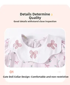 Detail of baby girl floral dress featuring a white Peter Pan collar and bow embroidery