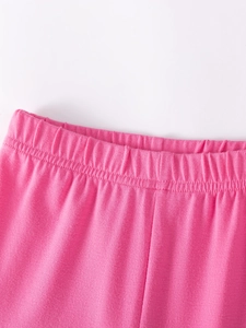 Pantalones de punto rosa vibrante para niña con cintura elástica y detalles florales