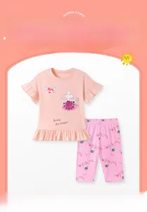 Close-up of pink girls' short sleeve top with ballet mouse appliqué and ruffle trim