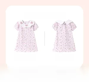 Front and back view of pink girl's dress with bunny prints and Peter Pan collar