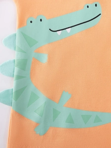 T-shirt arancione per bambini con coccodrillo verde e dettagli 3D sulla schiena