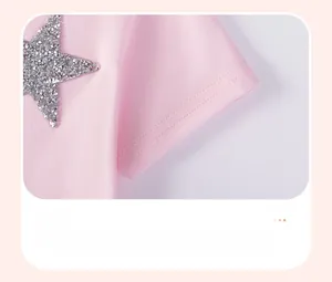 Detail of pink cotton sleeve with double stitching and silver glitter star patch