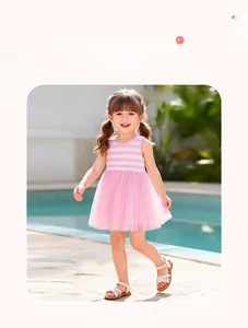 Detail of girls sleeveless striped mesh princess dress worn outdoors by a swimming pool