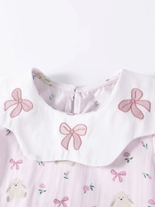 Girl's summer dress featuring pink bunny prints and embroidered Peter Pan collar detail