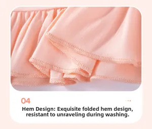 Detail of a pink cotton girl's outfit with delicate ruffle stitching and reinforced hem