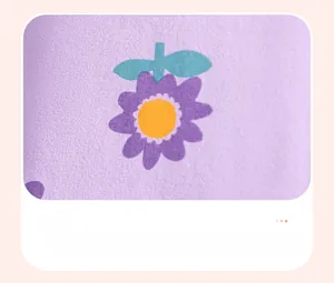 Detail of purple knitted cotton fabric with cute daisy print for baby girl summer outfit