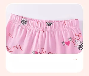 Close-up of pink cotton kids pants featuring elastic waistband and ballet mouse prints