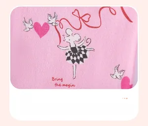 Detail shot of soft pink cotton baby outfit with ballet mouse print and magic lettering