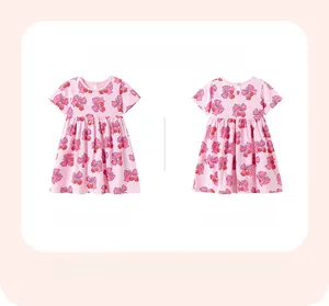Vue à plat de la robe rose pour filles avec motifs cerises montrant l'avant et l'arrière