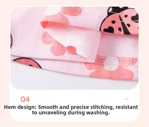 Détail de l'ourlet pour ensemble fille avec imprimé coccinelle et couture à double aiguille