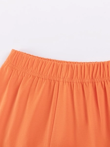 Ensemble enfant orange avec taille élastique et détails de couture renforcés