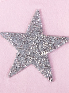 Pink knit girls dress featuring a large sparkling silver rhinestone star applique