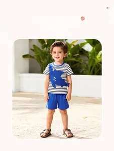 Detailed model view of boys' summer set with blue striped shark t-shirt and shorts