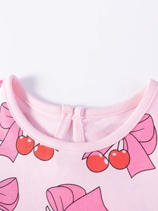 Robe rose en coton pour filles avec motifs cerises et nœuds et col rond confortable