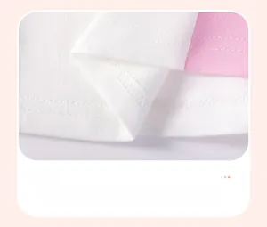 Detailed view of the dual-tone cotton knit hem with precision double-needle stitching