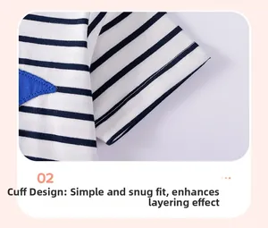 Detailed macro view of striped cotton t-shirt sleeve featuring a blue star applique
