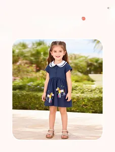 Detail of dark blue girl dress featuring white Peter Pan collar and cartoon horse embroidery