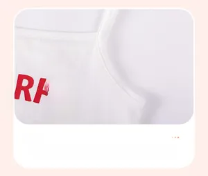 Close-up of fine stitching and red letter print on white cotton girls tank top