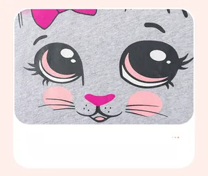 Detailed view of gray knit cotton fabric featuring a cute pink cartoon cat print