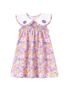 Abito smanicato a fiori per bambina con colletto Peter Pan bianco e smock