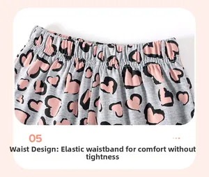 Detail of high-elasticity waist design on girl's grey cotton shorts with pink heart leopard print