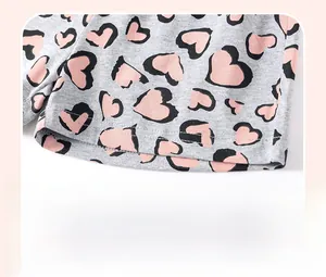 Detail of grey knit shorts featuring heart leopard print and durable double stitching