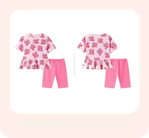 Detailed front and back view of pink girls' summer set with cherry and bow pattern