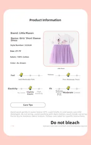 Detail view of girls short sleeve cotton dress with fairy prints and purple tulle skirt