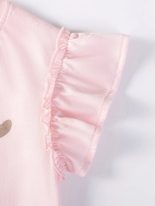 Toddler girl pink summer top featuring ruffle sleeve details and cotton knit texture