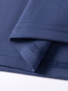 Short sleeve navy knit dress for girls featuring premium double-stitch hem details