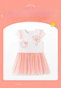 Detail of baby girl tutu dress with pink floral embroidery and sparkly sequin mesh layers
