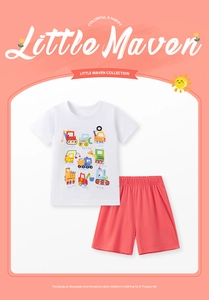 Detail of kids cotton set featuring cartoon construction vehicles on a white t-shirt