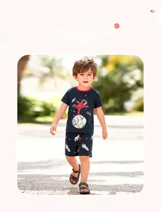 Toddler boy summer set with navy t-shirt featuring astronaut print and starry rocket shorts