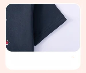 Close-up of navy blue short sleeve cuff with double-needle stitching and print detail