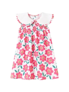 Abito estivo bianco da bambina con motivi floreali rosa sorridenti e colletto Peter Pan