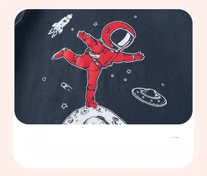 Close-up of boys' cotton t-shirt with space print featuring astronauts and rockets