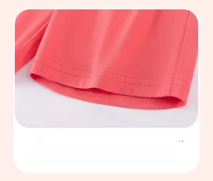 Detail of coral cotton shorts featuring durable double-needle stitching on the leg opening