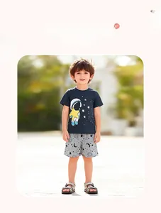 Detail of boys navy cotton t-shirt and grey shorts with astronaut and star pattern