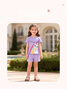 Detail of girl's summer outfit with magic cat print t-shirt and star pattern purple shorts