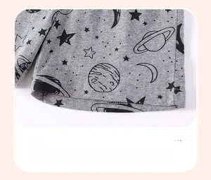 Detail of grey cotton shorts with space prints and reinforced double-needle hem stitching