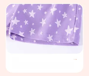 Detail of purple cotton shorts leg featuring white star pattern and neat flat stitching