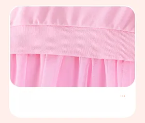 Detail of pink ribbed knit waist and soft tulle mesh skirt on girl's summer dress