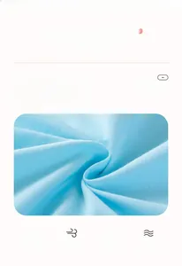 Detail of soft 100% cotton blue fabric for girls' summer sets with breathable texture