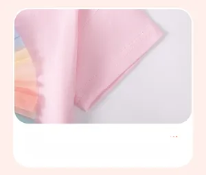 Detail of pink cotton sleeve featuring colorful rainbow mesh ruffles and soft texture