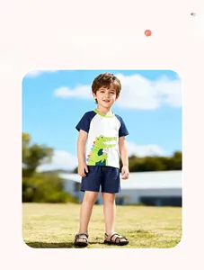 Outdoor model shot of white and navy cotton set with cartoon crocodile graphic