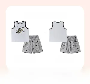 Flat lay view of boys star and planet print pajama set showing front and back detail