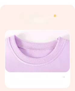 Detail of the ribbed round neckline on a purple cotton summer dress for girls