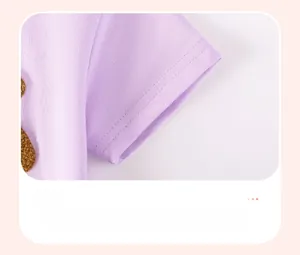 Detail of short sleeves with durable double-stitched seams and soft knit purple fabric