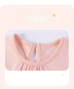 Detail of round neckline and back button closure on pink cotton baby princess dress